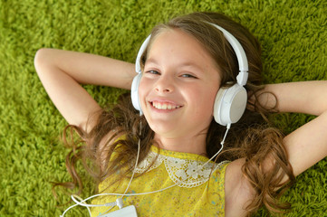 Cute little girl with headphones