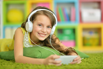 Cute little girl with headphones