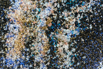Layered colorful sand pattern. Marble style background. Blue and gold powder texture.