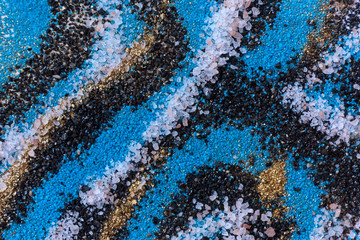 Layered colorful sand pattern. Marble style background. Blue and gold powder texture.