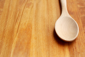 Wooden Spoon on Cutting Board