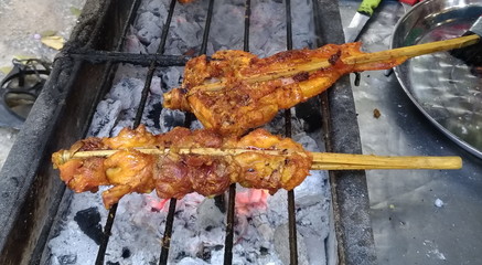 Toast chicken on the stove, Thai style food.