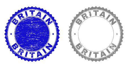 Grunge BRITAIN stamp seals isolated on a white background. Rosette seals with grunge texture in blue and gray colors. Vector rubber imitation of BRITAIN text inside round rosette.