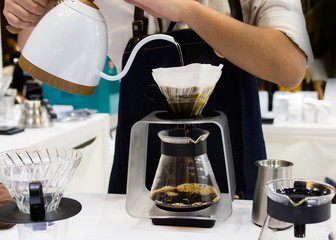 Barista is making coffee, coffee preparing with chemex