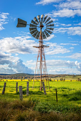 Southern Cross windmill in a rural field with crops