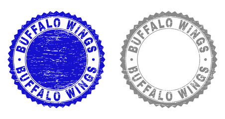 Grunge BUFFALO WINGS stamp seals isolated on a white background. Rosette seals with distress texture in blue and grey colors. Vector rubber imitation of BUFFALO WINGS label inside round rosette.