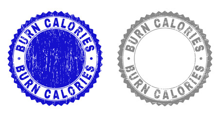 Grunge BURN CALORIES stamp seals isolated on a white background. Rosette seals with distress texture in blue and grey colors. Vector rubber imprint of BURN CALORIES text inside round rosette.