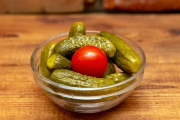 Foto op Plexiglas Pickles in the glass jar on the wooden table © vitalis83