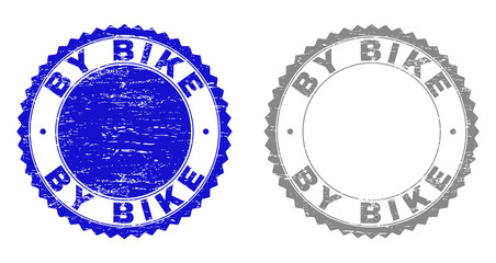 Grunge BY BIKE stamp seals isolated on a white background. Rosette seals with grunge texture in blue and gray colors. Vector rubber imprint of BY BIKE caption inside round rosette.