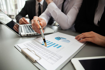 co-working team meeting concept, businessteam using smartphone and digital tablet and laptop computer in modern office.