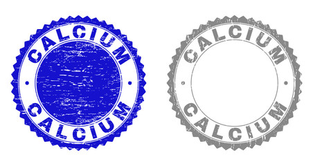 Grunge CALCIUM stamp seals isolated on a white background. Rosette seals with grunge texture in blue and gray colors. Vector rubber imprint of CALCIUM text inside round rosette.