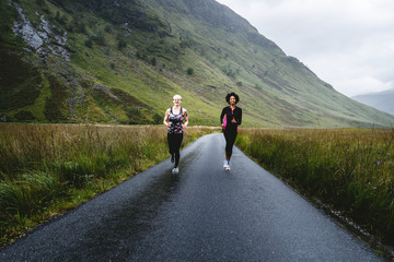 Friends jogging in the Scottish Highlands