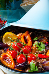 Tasty spicy beef with various vegetables cooked in tagine