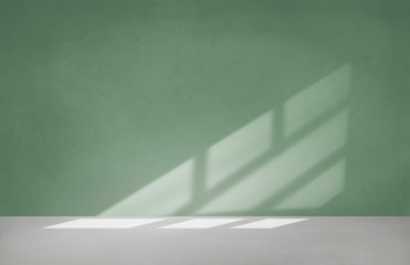 Green wall in an empty room with concrete floor