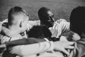 Football players huddle before a match