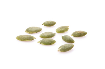 Raw pumpkin seeds on white background