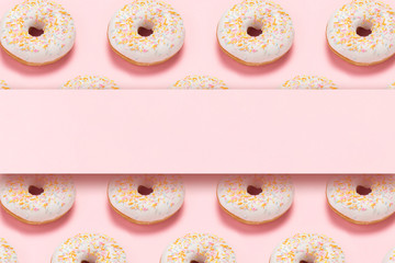 Fresh tasty sweet donuts on a pink background. Place for text. The concept of fast food, bakery, breakfast, sweets. Minimalism. Pattern. Flat lay, top view, copy space.