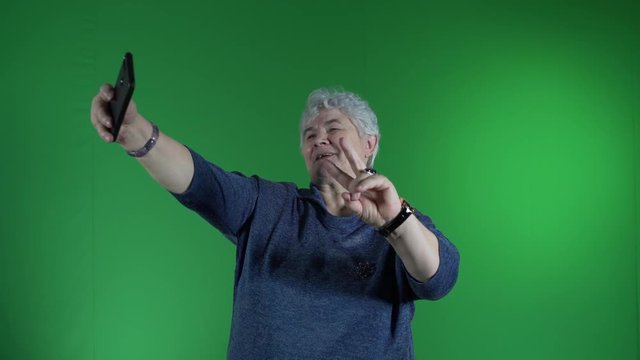 Elderly woman making selfie