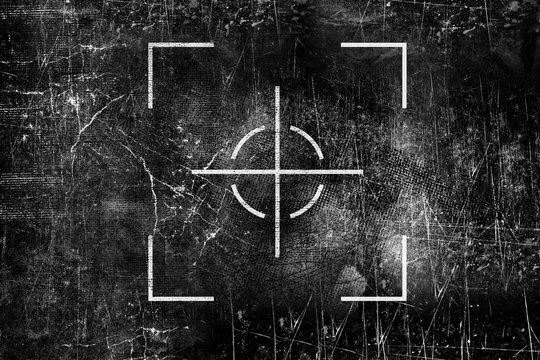 Crosshair sign on old grungy surface. Rifle scope symbol. Target mark. Grunge monochrome illustration