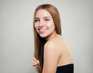 Fototapeta premium Happy girl with long healthy hair and perfect skin on white background, portrait