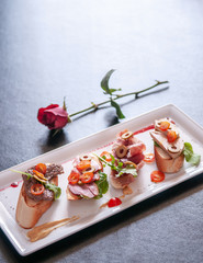 Carpaccio bread Foie gras, Pamaham, smoked duck, beef steak and cranberries sauce