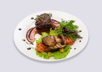 Meat in red sauce with mushrooms and herbs on a plate-2