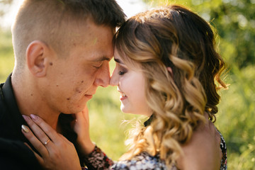 Fototapeta premium Portrait of a happy young couple enjoying a day in the park together