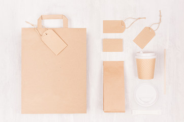 Coffee branding mockup - brown paper cup with blank bag, packet, label, cap, card, sugar on white...