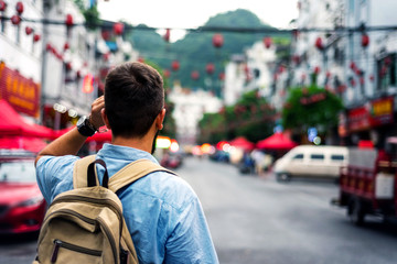 Traveler exploring Asian food market street