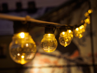 included yellow lights on the wire one by one with blurred foreground and background