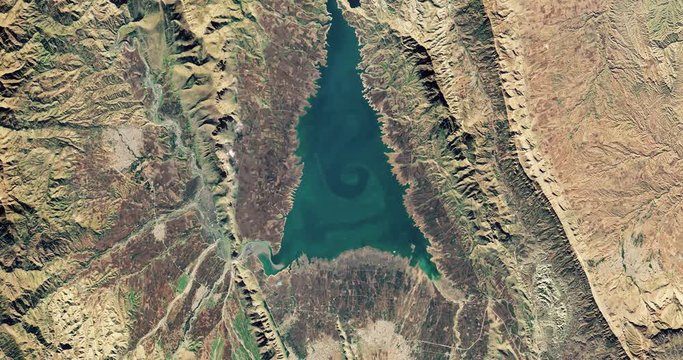 Very high-altitude overflight aerial of  Zagros Mountains, adjacent plains, Iraqi Kurdistan. Reversible, seamless loop. Elements of this image furnished by NASA. 