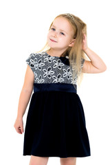 Naklejka premium Little girl posing in studio on a white background.