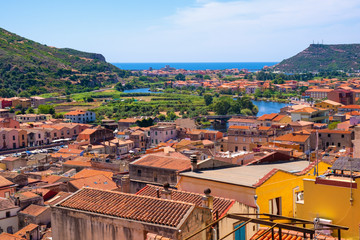 Sardinia, Italy - Panoramic view of the town of Bosa by the Temo river with Bosa Marina resort at...