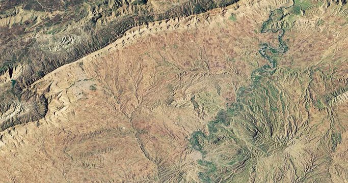 Very high-altitude overflight aerial of  Zagros Mountains, adjacent plains, Iraqi Kurdistan. Reversible, seamless loop. Elements of this image furnished by NASA. 