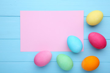 Colorful easter eggs on a blue wooden background