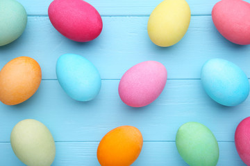 Colorful easter eggs on a blue wooden background