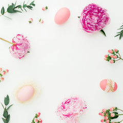 Ester composition with eggs, pink peonies, hypericum and eucalyptus branches on white background....