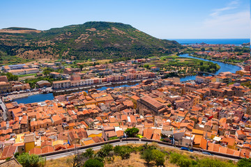 Sardinia, Italy - Panoramic view of the town of Bosa by the Temo river with Bosa Marina resort at...