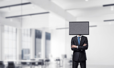 Businessman with TV instead of head.