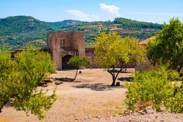 Bosa, Sardinia, Italy - Inner courtyard with monumental historic defense walls and fortification of...