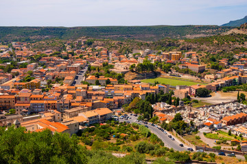 Fototapeta na wymiar Sardinia, Italy - Panoramic view of the town of Bosa and surrounding hills seen from Malaspina Castle hill - known also as Castle of Serravalle