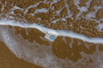 Italian Tile on a Sandy Beach with Surf