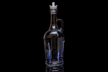 glass bottle on black background