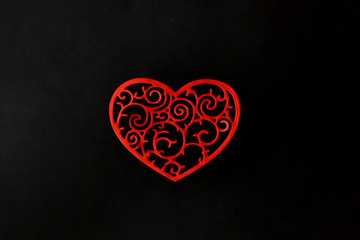  red tracery heart on a black background