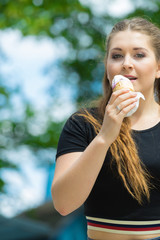 Young woman eating ice cream