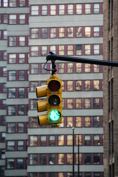 A green traffic light on a interception in down town Manhattan in New York city