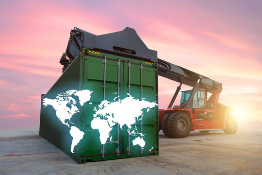 Worldwide shipping lositics background with reach stacker and beautiful sunset.
