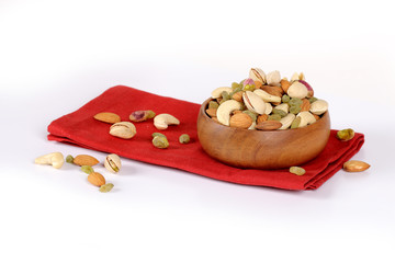 ssorted nuts on white, dry fruits, mix nuts, almond, cashew, pistachio, raisin