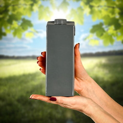 Juice product in woman hands. Free space for your decoration.