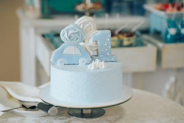 First Birthday, cake and teddy bear. Cake with a bear for the first year